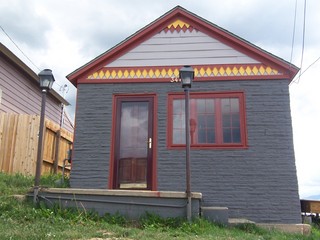 309729646 We saw a lot of quirky houses like this in Leadville...a lot of them have different shaped shingles (ala the Victorian Age) painted in bright colors.
